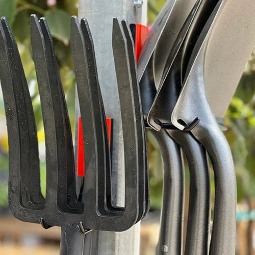 Gator Magnetics The Complete Workshop 10 Bundle — garden rakes hanging from red hooks on an outdoor steel pole
